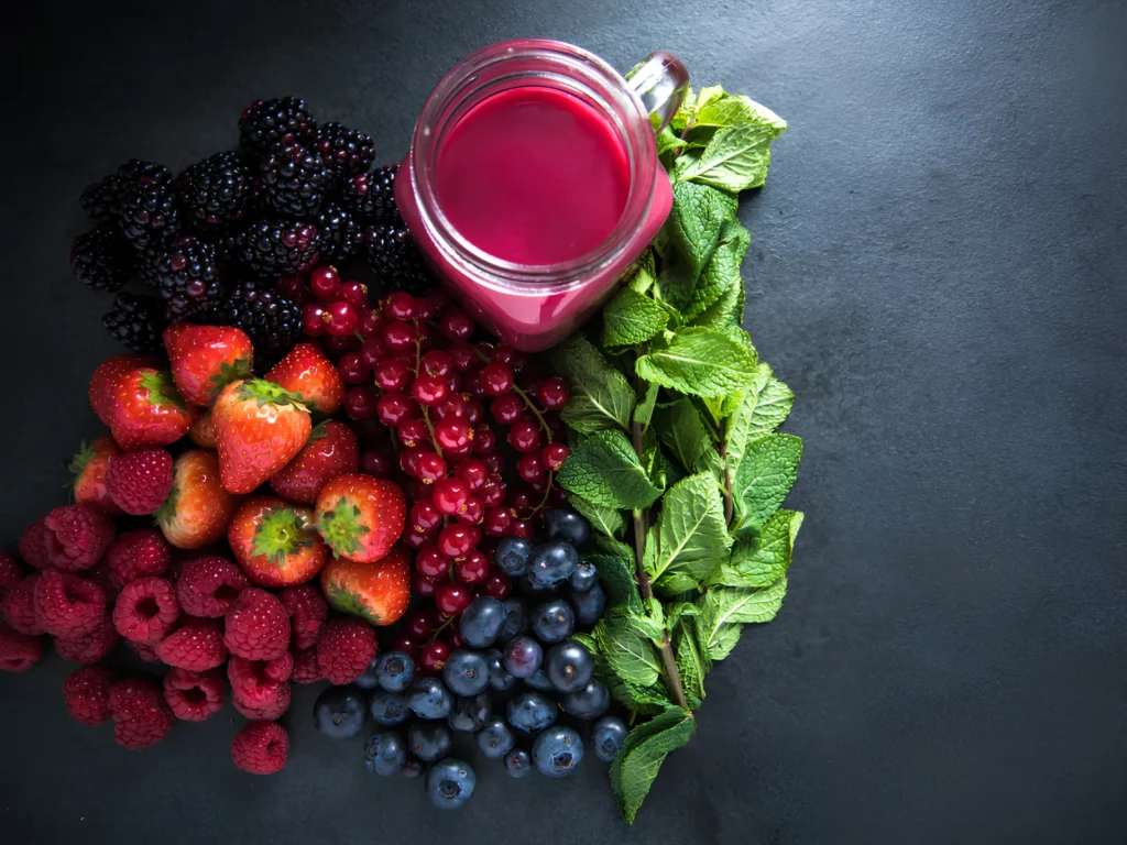 Image of berries and greens that contain antioxidants.
